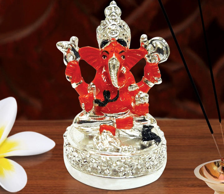 Captivating Mini Ganesha Idol in Silver and Orange with Base