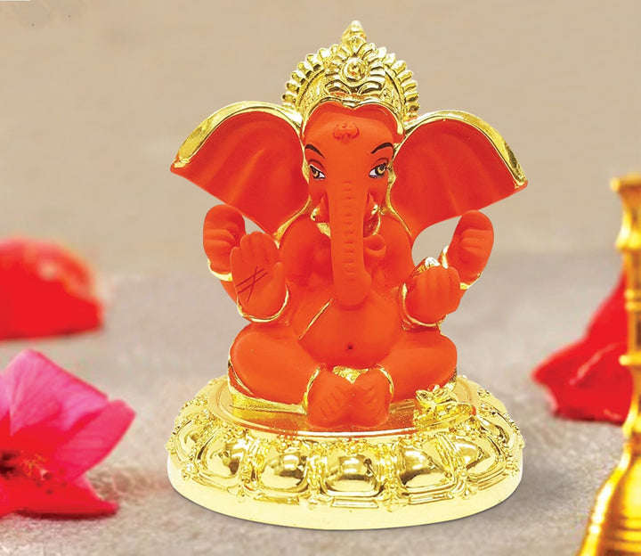 Captivating Mini Ganesha Idol in Orange and Gold with Four Hands