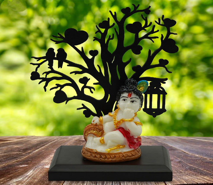 Decorative Figurine with Cultural Significance and Wooden Tree