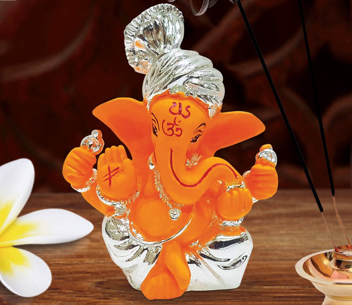 Captivating Silver-Plated Orange Ganesha Idol