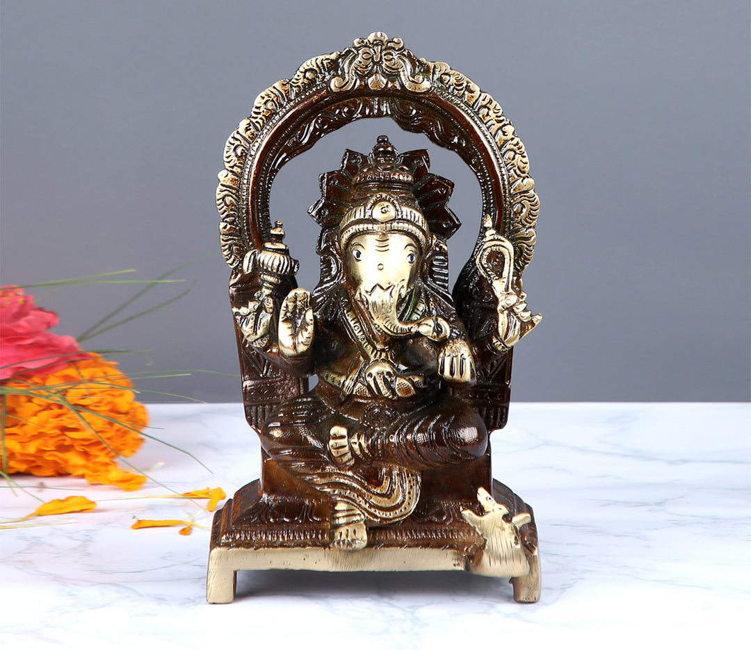 Ornate Brass Figurine on a Throne