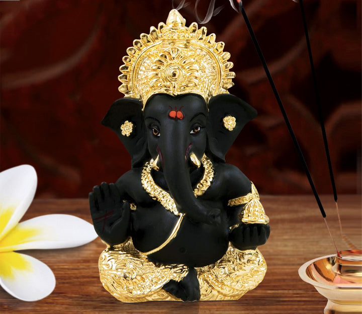 Captivating Black Ganesha Idol with Gold Mukut
